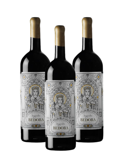 Three dark glass wine bottles with gold foil at the top and ornate white labels featuring a crowned figure and the brand name BEDORA, shown on a plain white background.