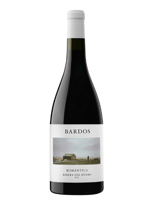 Red wine bottle with a landscape farm image label, on a white background.
