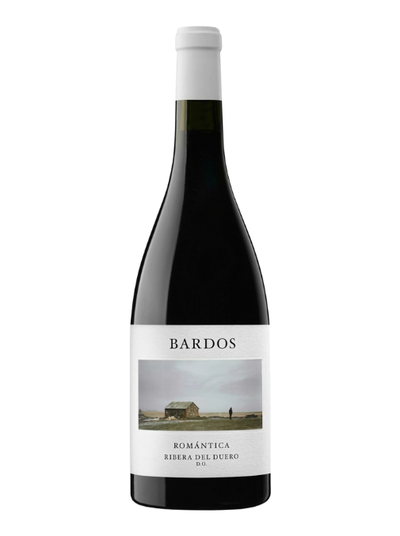 Red wine bottle with a landscape farm image label, on a white background.