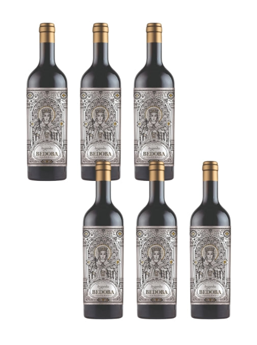 Set of six Bedoba wine bottles with decorative labels on a white background