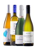 A selection of four greek wines against a white background.
