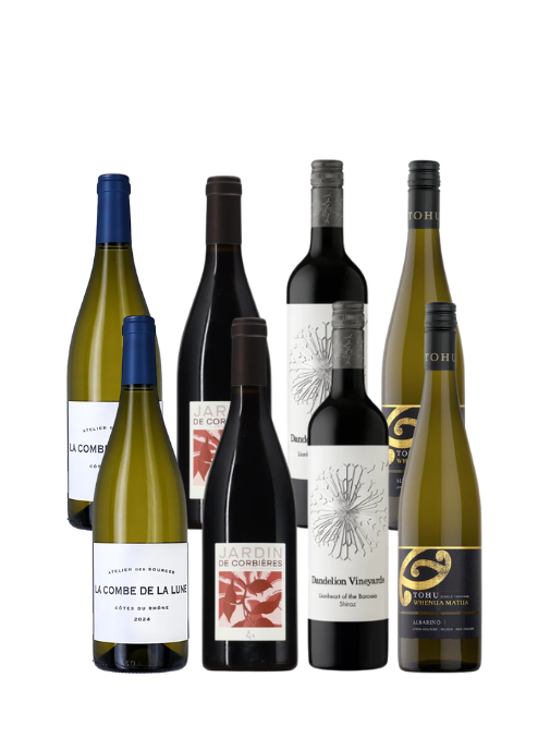 A group of seven wine bottles from the brand Torrija, arranged against a plain white background. The bottles include various white and red wines in green and dark glass bottles with blue, black, and white labels.